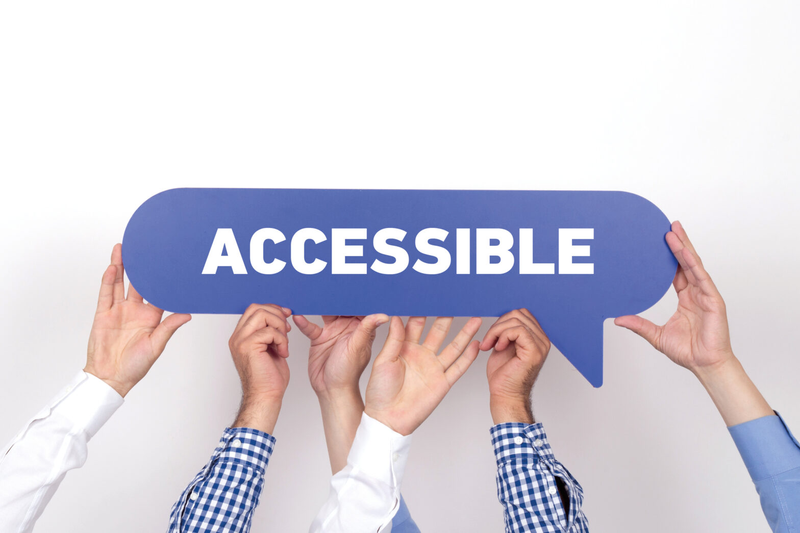 several hands holding up a sign with the inscription "accessible"